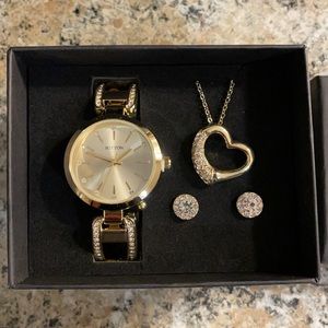 Gold watch, necklace and earrings